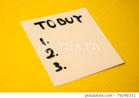 Yellow paper sticker with the words what to buy on a yellow paper background. Yellow paper sticker with the words what to buy on a yellow paper background. 79246351