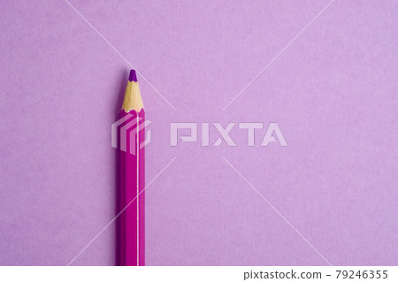 Pink pencil on pink paper background. Close up. 79246355