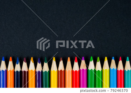 Color pencils on black background top view. Copy space. 79246370