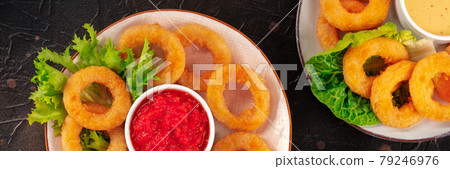 Calamari rings panorama. Deep fried squid rings with green salad 79246976