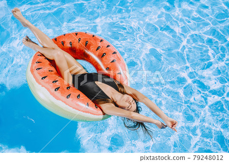 Beautiful and elegant girl on a resort Beautiful and elegant girl on a resort 79248012