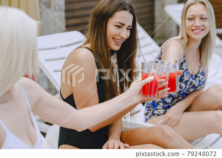 Three elegant girls on a resort 79248072
