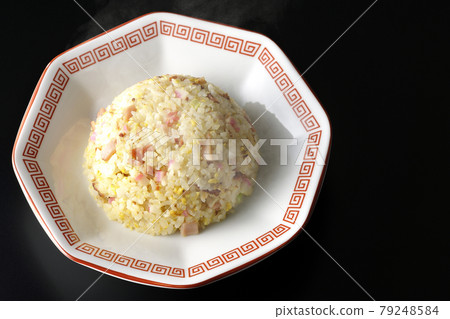 A bird's-eye view of hot Gomoku fried rice with various ingredients such as Narutomaki and char siu on a black background A bird's-eye view of hot Gomoku fried rice with various ingredients such as Narutomaki and char siu on a black background 79248584