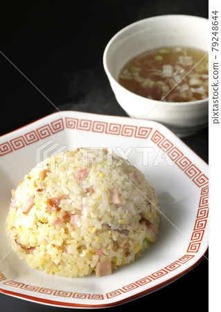 Photographed hot Gomoku fried rice and Chinese soup with various ingredients such as Narutomaki and char siu on a black background Photographed hot Gomoku fried rice and Chinese soup with various ingredients such as Narutomaki and char siu on a black background 79248644