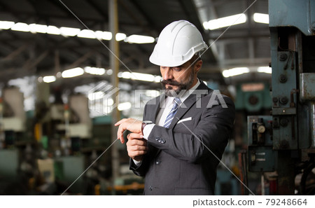 Engineer manager and Factory Workers Team checking machine in production line. Teamwork concept. 79248664