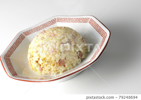 A hot five-eyed fried rice with various ingredients such as Narutomaki and char siu taken on a white background 79248694