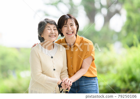 Senior women, young women, fresh green care, smiles 79250106