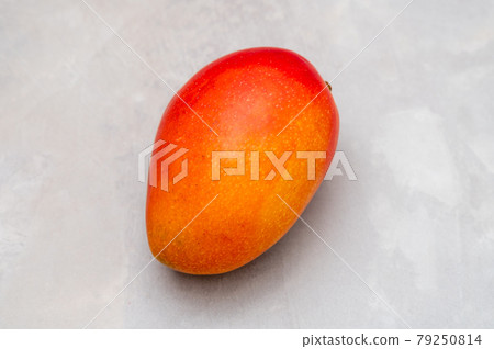 Mango on a wooden plate Mango on a wooden plate 79250814