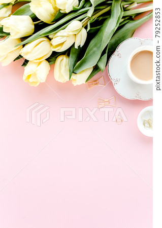 Female workspace with tulip flowers bouquet, golden accessories, diary, on pink background. Flat lay women's office desk. Top view feminine background Female workspace with tulip flowers bouquet, golden accessories, diary, on pink background. Flat lay women's office desk. Top view feminine background 79252853
