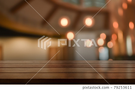 Empty wooden table top with lights bokeh on blur restaurant background. 79253611