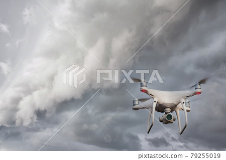 UAV drone copter flying with digital camera.  79255019