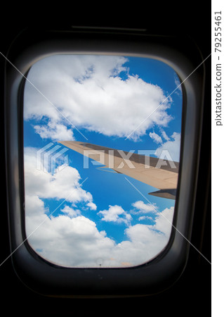 Skyscape through aero plane window during flight Skyscape through aero plane window during flight 79255461