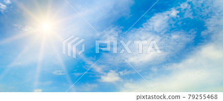 blue sky , sun and beautiful white clouds. Wide photo. 79255468