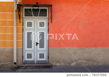 Colorful antique door. Wooden door with decoration elements in old building facade. Tallinn, Estonia Colorful antique door. Wooden door with decoration elements in old building facade. Tallinn, Estonia 79257949