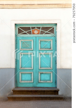 Colorful antique door. Wooden door with decoration elements in old building facade. Tallinn, Estonia Colorful antique door. Wooden door with decoration elements in old building facade. Tallinn, Estonia 79257950