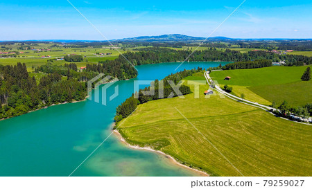 Aerial view over Lake Forggensee at the city of Fuessen in Germany Aerial view over Lake Forggensee at the city of Fuessen in Germany 79259027