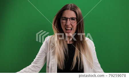 Young woman looks very irritated 79259078