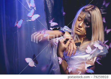 fashion beautiful young woman surrounded by butterflies. fashion beautiful young woman surrounded by butterflies. 79259910