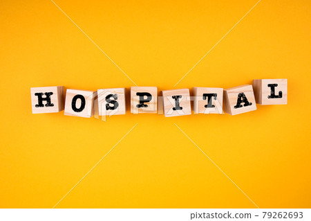 Hospital. Wooden cubes with text on a yellow background 79262693