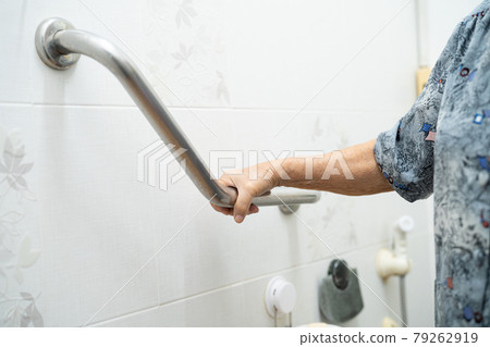Asian senior or elderly old lady woman patient use toilet bathroom handle security in nursing hospital ward, healthy strong medical concept. Asian senior or elderly old lady woman patient use toilet bathroom handle security in nursing hospital ward, healthy strong medical concept. 79262919