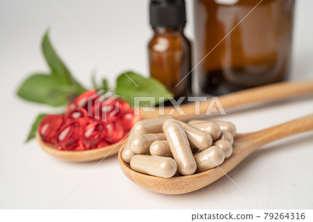 Alternative medicine herbal organic capsule with vitamin E omega 3 fish oil, mineral, drug with herbs leaf natural supplements for healthy good life. Alternative medicine herbal organic capsule with vitamin E omega 3 fish oil, mineral, drug with herbs leaf natural supplements for healthy good life. 79264316