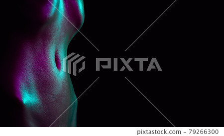 Sexy naked wet body of a girl with water drops. A skinny belly in the neon light 79266300