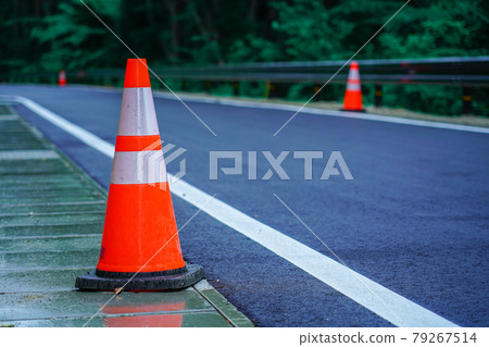 Red and white color cones (triangular cones, road cones, pylon) Red and white color cones (triangular cones, road cones, pylon) 79267514