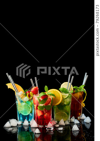 Long Island Ice Tea, Mojito and Blue Lagoon Cocktails - studio shot on black background 79268173