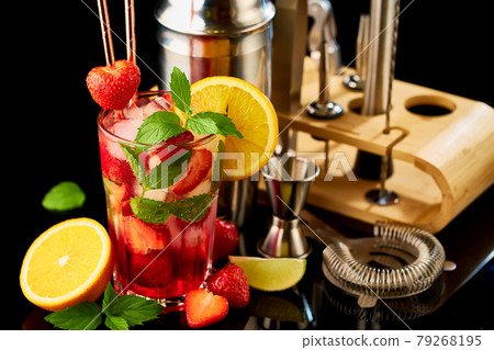 Strawberry mojito with lemon and mint isolated on black background with reflection Strawberry mojito with lemon and mint isolated on black background with reflection 79268195
