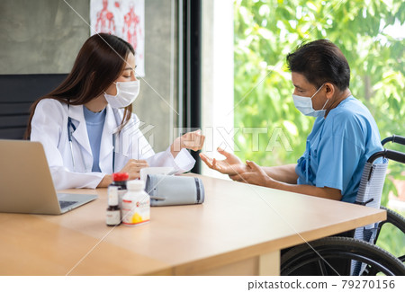 Young asian woman doctor encouragement and supportive to cansor patient after consult and examine in clinic hospital health ideas concept. Problem talk at medical checkup visit with wheelchair . Young asian woman doctor encouragement and supportive to cansor patient after consult and examine in clinic hospital health ideas concept. Problem talk at medical checkup visit with wheelchair . 79270156