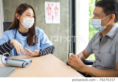 Young asian woman doctor encouragement and supportive to cansor patient after consult and examine in clinic hospital health ideas concept. Problem talk at medical checkup visit with wheelchair . Young asian woman doctor encouragement and supportive to cansor patient after consult and examine in clinic hospital health ideas concept. Problem talk at medical checkup visit with wheelchair . 79270157