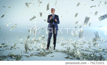 Cheerful businessman dancing under money rain Cheerful businessman dancing under money rain 79272831