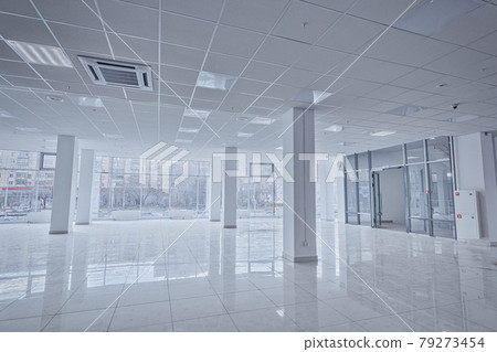 Spotlight and empty space. Empty office space in modern building. Interior of empty unfinished modern market. Architecture concept. Empty white room has white walls. Shopping center Spotlight and empty space. Empty office space in modern building. Interior of empty unfinished modern market. Architecture concept. Empty white room has white walls. Shopping center 79273454