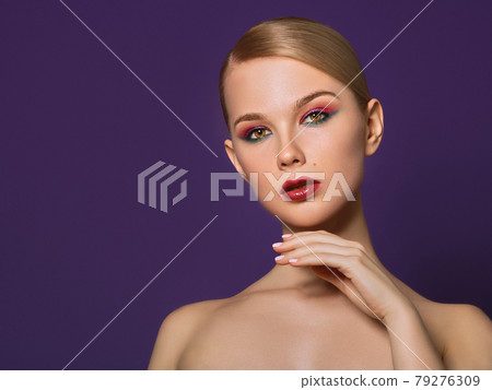 Beauty close-up portrait of beautiful woman model face with magic creative fashion multicolored make up . Face painting, cosmetics, beauty and makeup . Beauty close-up portrait of beautiful woman model face with magic creative fashion multicolored make up . Face painting, cosmetics, beauty and makeup . 79276309