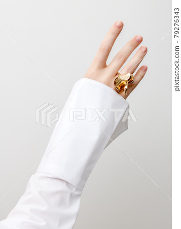 Beautiful Woman Hands . closeup hands of young woman with natural manicure polished nails wearing an expensive engagement ring . Minimalism 79276343