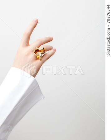 Beautiful Woman Hands . closeup hands of young woman with natural manicure polished nails wearing an expensive engagement ring . Minimalism 79276344