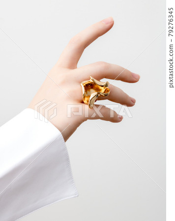 Beautiful Woman Hands . closeup hands of young woman with natural manicure polished nails wearing an expensive engagement ring . Minimalism 79276345