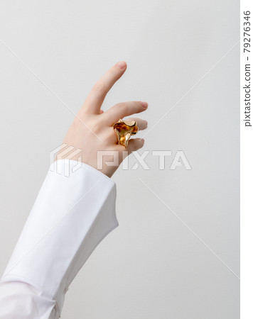 Beautiful Woman Hands . closeup hands of young woman with natural manicure polished nails wearing an expensive engagement ring . Minimalism 79276346