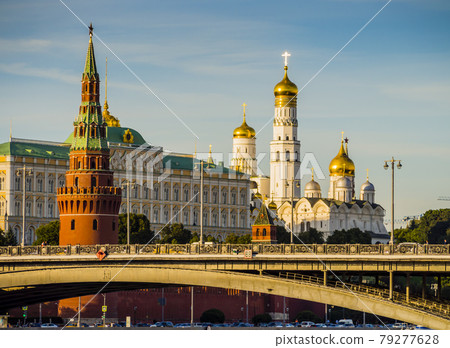 Russia, stunning skyline of Moscow with Kremlin towers over Moskva river bridge 79277628