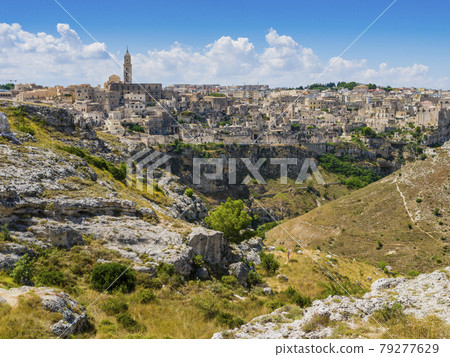 Dramatic view of the ancient town of Matera and its deep canyon, Basilicata region, southern Italy Dramatic view of the ancient town of Matera and its deep canyon, Basilicata region, southern Italy 79277629