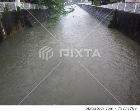 Hiradonagaya River flooded by heavy rain 79278769