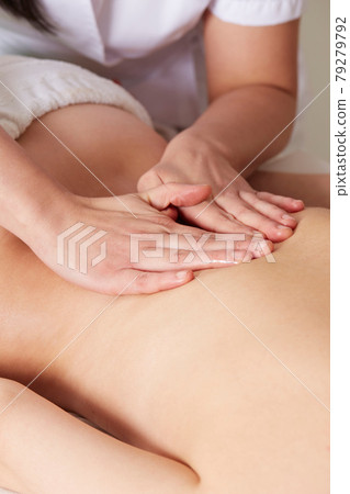 Female Enjoying Relaxing Massage In Cosmetology Spa Center 79279792