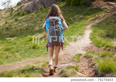 hiker walking in mountains hiker walking in mountains 79279883