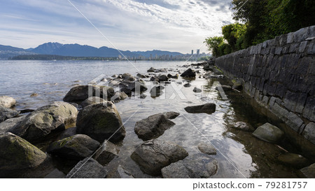 Rocky coast framed by rock wall, shot in Vancouver, British Columbia, Canada 79281757