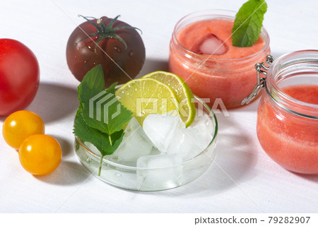 Tomatoes pulp, lemon, mint leaves, ice cubes - ingredients for organic home made cosmetic. 79282907