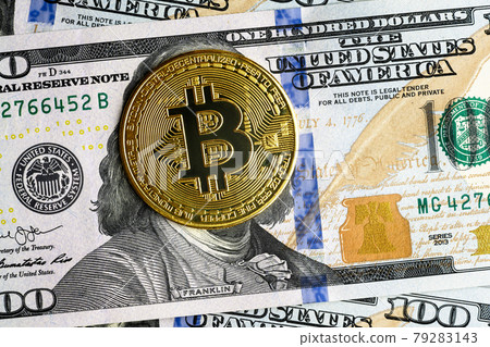 Bitcoin vs US dollar, gold bit coins on 100 dollar bill 79283143