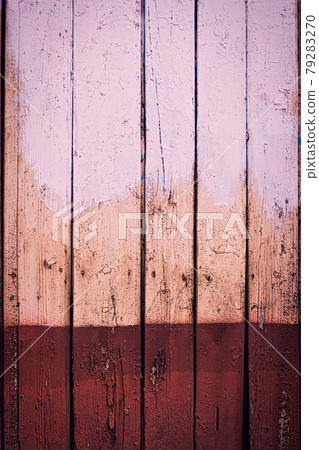 Rustic wooden wall with rundown two-color paint. Home interior DIY project. Messy board half brown color. Rustic wooden wall with rundown two-color paint. Home interior DIY project. Messy board half brown color. 79283270