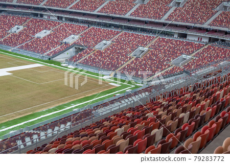 Empty seats on the tribune of a soccer stadium Empty seats on the tribune of a soccer stadium 79283772
