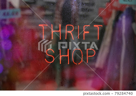 Vintage Neon Thrift Shop Sign in Wet Rainy Window Vintage Neon Thrift Shop Sign in Wet Rainy Window 79284740