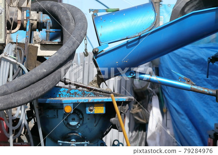 Image of sending concrete to a pump car Image of sending concrete to a pump car 79284976